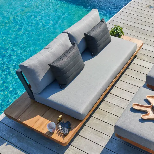 The Fitz Roy combines Indonesian SVLK-certified teak with a durable aluminum frame for a sophisticated outdoor statement piece. Features all-weather Sunbrella cushions, quick-drying textilene inlays, and convenient integrated side tables.