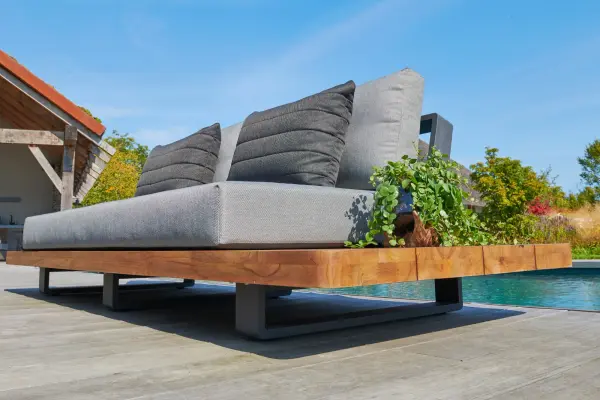 The Fitz Roy combines Indonesian SVLK-certified teak with a durable aluminum frame for a sophisticated outdoor statement piece. Features all-weather Sunbrella cushions, quick-drying textilene inlays, and convenient integrated side tables. - alternate view