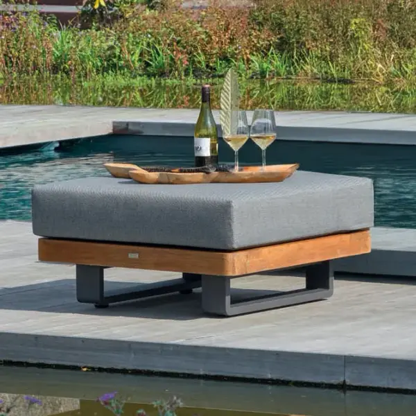 The Fitz Roy Teak Ottoman combines Indonesian-certified grade A teak with a powder-coated aluminum frame for lasting outdoor elegance. Features plush Sunbrella cushioning and pairs perfectly with the modular Fitz Roy collection. - alternate view