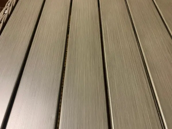 The Palma Wicker Coffee Table combines handwoven weatherproof rattan with a durable aluminum frame, creating a versatile piece that transitions seamlessly between casual dining and relaxed entertaining in outdoor spaces. - alternate view