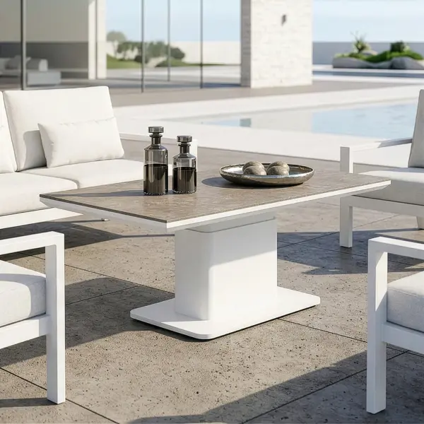 The LUKA Adjustable Height Table brings effortless versatility to your outdoor space, making it easy to shift from casual mornings with coffee to relaxed dining with family and friends. Its clean white frame and modern concrete-look top create a fresh, elevated style that complements any setting. Designed for everyday living, it offers a smooth, simple height adjustment so you can adapt your space in seconds. Whether you’re hosting, relaxing, or enjoying a quiet moment outside, Luka makes every experience feel easy, comfortable, and beautifully put together. Robust powder-coated aluminum construction with stainless steel hardware Durable ceramic top with a concrete look finish can withstand temperatures ranging from -40°F to 500°F Highly resistant to scratching, staining, discoloring, and warping All-in-one Coffee & Dining Table! Easily & quickly adjusts between 19" H to 29" H for convenient versatility No umbrella hole, perfect for cantilever umbrellas Integrated foot levelers prevent wobbling on uneven floors and prolong furniture life Frame Color: White Top Color: Concrete Look