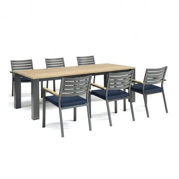 The Elba 7-Piece Dining Set delivers contemporary rustic style with FSC-certified teak and powder-coated aluminum construction. Features stackable chairs with thick foam cushions and Sunbrella fabric for ultimate outdoor durability. - alternate view