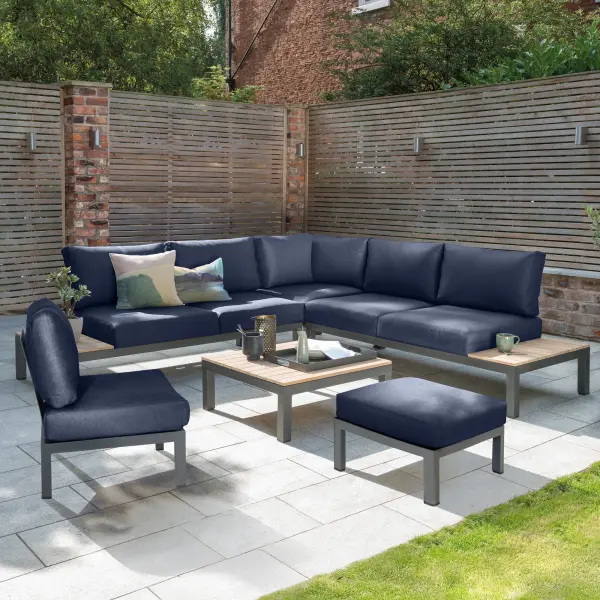 The Elba 6-piece modular set combines sleek charcoal aluminum frames with FSC-certified teak accents and weather-resistant Sunbrella cushions. Configurable design seats up to 5 comfortably for lounging or entertaining outdoors. - alternate view