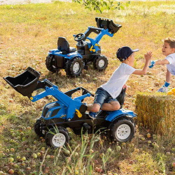 This premium pedal tractor combines authentic New Holland styling with practical features like a functional front loader, adjustable seat, and oversized air tires. German engineering ensures durability and smooth operation. - alternate view