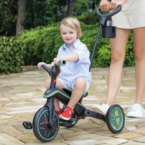 The Explorer Trike transforms seamlessly through four developmental stages, from infant trike to balance bike, serving children ages 10 months to 5 years. Features patented folding system, tool-free assembly, and parent steering controls. - alternate view