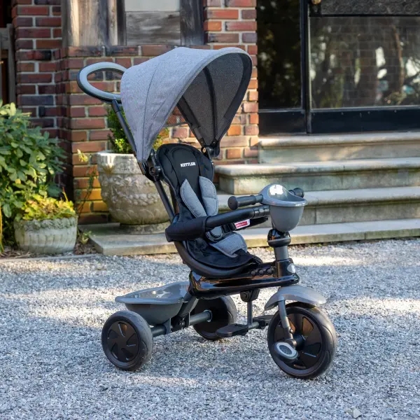 The KETTLER Happy Navigator transforms from parent-controlled ride-on to independent tricycle, adapting through four developmental stages from 10 to 72 months with adjustable features and comprehensive safety systems. - alternate view