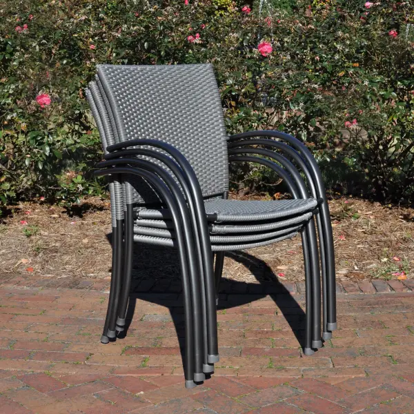 The Pilano Woven Stackable Arm Chairs combine contemporary design with exceptional outdoor durability. Featuring hand-woven weatherproof polymer weave and aluminum frames with proprietary Electrotherm coating, these chairs offer comfort and style while stacking for easy storage. - alternate view