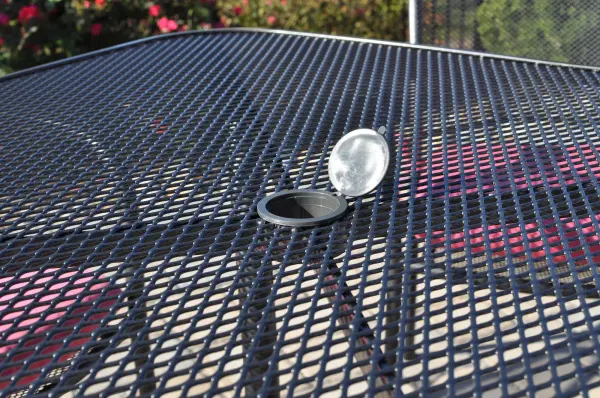 This 79-inch wrought iron table features KETTLER's exclusive Electrotherm coating technology, offering superior durability and weather resistance. The mesh top design ensures excellent drainage while the fully-welded construction provides exceptional stability for outdoor dining. - alternate view
