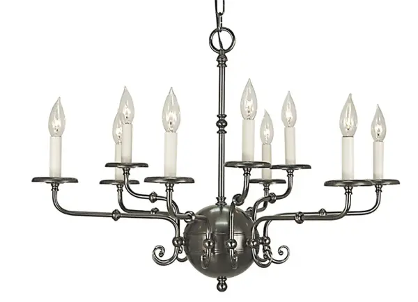 The Jamestown 9-light chandelier brings elegant traditional styling to larger dining spaces. Its 30-inch width and antique silver finish create a sophisticated focal point, while nine candle-style lights provide ample illumination.
