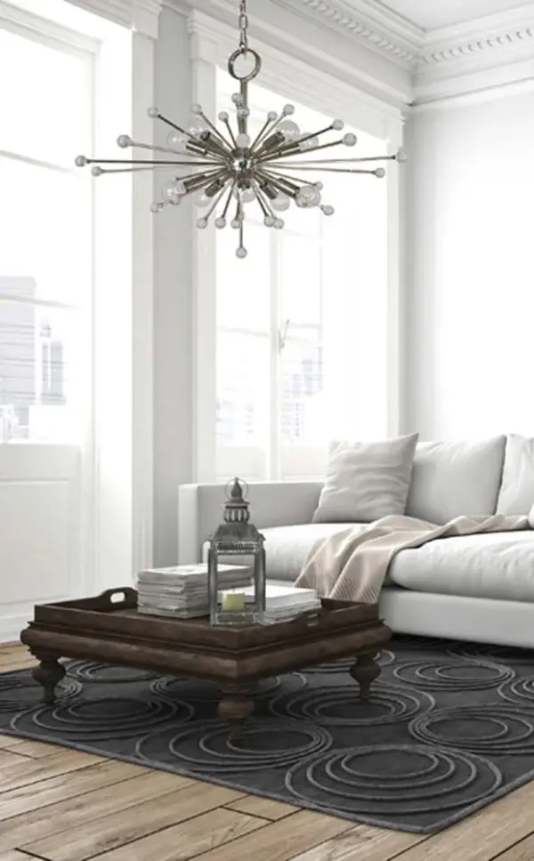 The Supernova chandelier creates a dramatic focal point with its contemporary starburst silhouette and 10 exposed bulbs. The polished nickel finish adds sophisticated shine while the 28-inch width makes it perfect for larger spaces. - alternate view