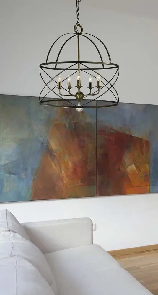 The Nantucket chandelier brings timeless charm with its candle-style design and sophisticated mahogany bronze and antique brass finish combination. At 22 inches wide, it's perfectly scaled for medium dining spaces and entryways. - alternate view