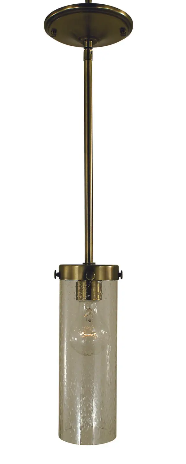 The Hammersmith pendant combines industrial styling with transitional appeal through its antique brass finish and clear seedy glass cylinder. At just 3" wide, it's perfect for tight spaces or clustered installations over islands.