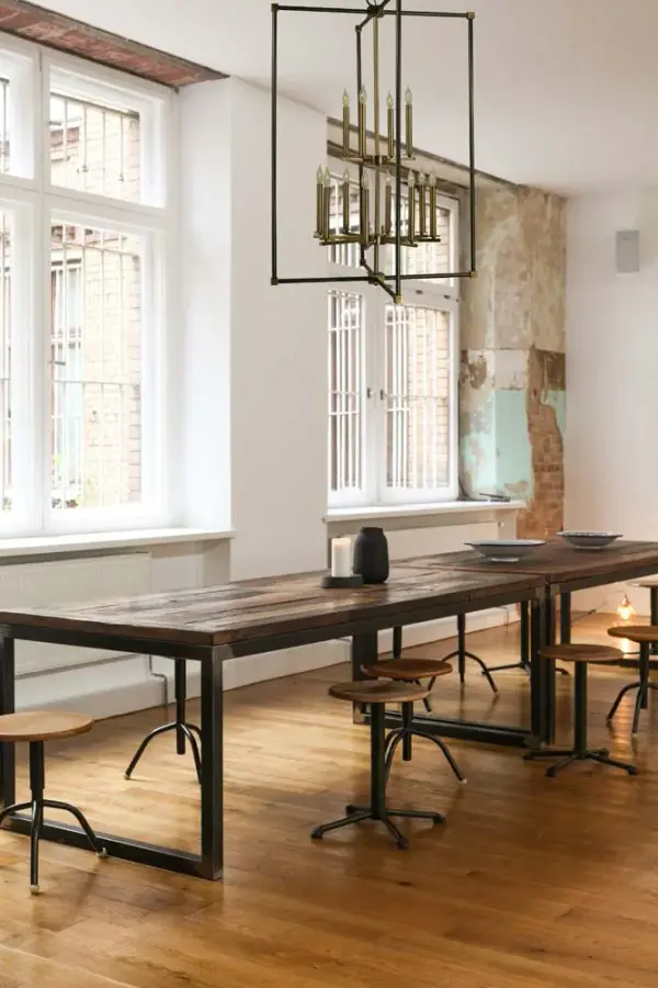 The Lexington chandelier makes a dramatic statement with 12 candle-style lights arranged in a classic tiered design. The sophisticated combination of Mahogany Bronze and Antique Brass finishes adds depth and warmth to traditional and transitional interiors. - alternate view