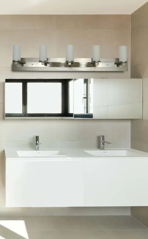 The Mercer 5-Light Sconce delivers exceptional illumination across a 48-inch span, perfect for large vanities and master bathrooms. Its mixed metal finish combines satin pewter with polished nickel accents for refined elegance. - alternate view