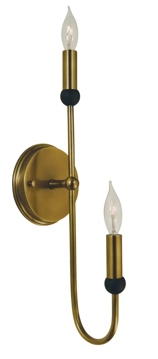 The Nicole sconce combines antique brass and matte black finishes in a striking 21-inch vertical design. Perfect for flanking mirrors or creating dramatic hallway lighting with its dual candle-style sockets.