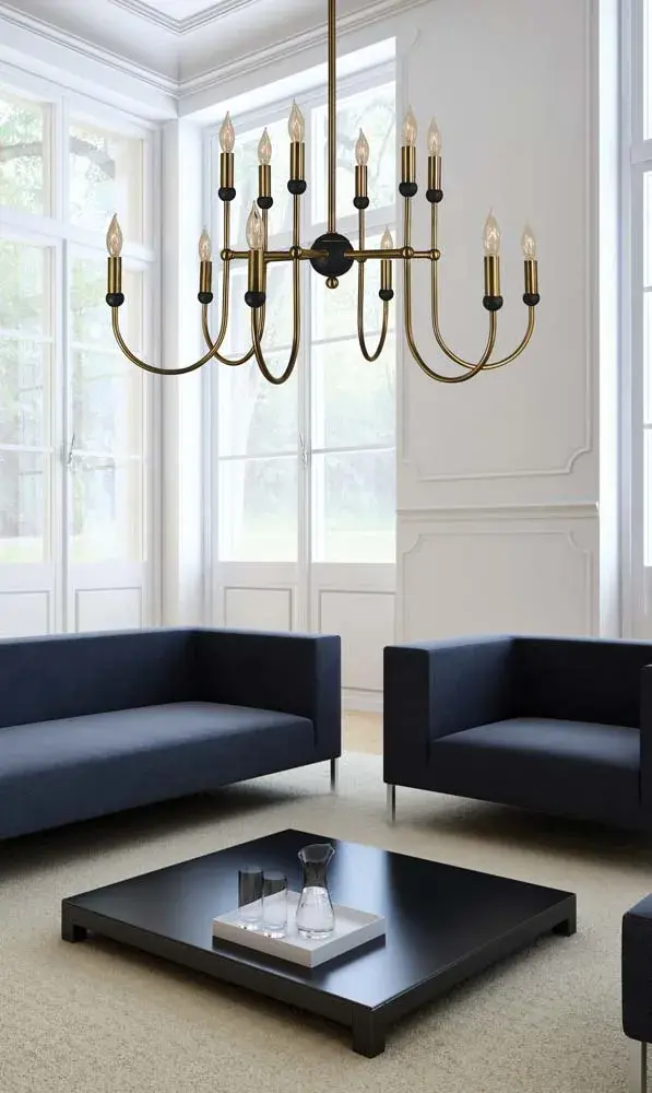 The Nicole chandelier combines antique brass warmth with modern matte black accents in a substantial 30-inch wide design. With 12 candle-style lights and adjustable hanging heights, it delivers dramatic illumination perfect for large dining rooms and grand entryways. - alternate view