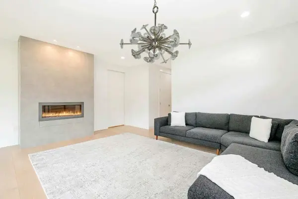 The Apogee chandelier delivers dramatic illumination with 12 lights arranged in a sophisticated 28-inch design. Its polished nickel finish brings refined elegance to dining spaces, while the substantial scale makes it perfect for larger rooms. - alternate view