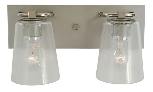 The Mercer bath sconce combines transitional styling with industrial charm through its mixed metal finish and seedy glass shades. At 15 inches wide, it provides balanced illumination for medium vanities.