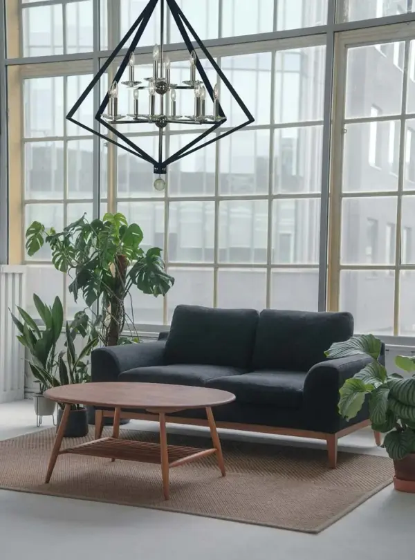 The Ice collection chandelier makes a bold architectural statement with 12 candle lights arranged in a striking 38-inch wide design. The polished nickel and matte black two-tone finish adds contemporary sophistication to grand spaces. - alternate view