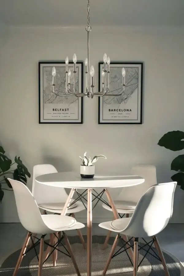 The Boulevard chandelier brings traditional elegance with its 10-light configuration and polished nickel finish. At 24 inches wide, it's perfectly sized for medium dining spaces while providing ample illumination. - alternate view