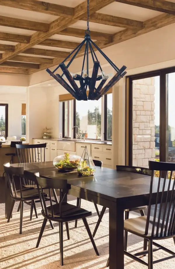 This 8-light chandelier combines rustic charm with industrial styling in a substantial 30-inch frame. The matte black finish and candle-style design create dramatic ambiance perfect for farmhouse and transitional interiors. - alternate view