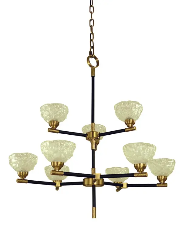 The Stonebridge chandelier combines antique brass warmth with modern matte black accents across nine lights. At 33 inches wide, this substantial fixture delivers both dramatic presence and ample illumination for large dining spaces.