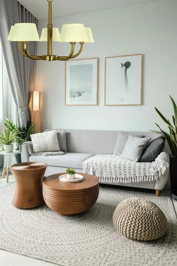 The Emma chandelier combines classic elegance with contemporary styling through its brushed brass finish and clean-lined silhouette. Five lights with linen shades provide warm, diffused illumination perfect for dining spaces. - alternate view