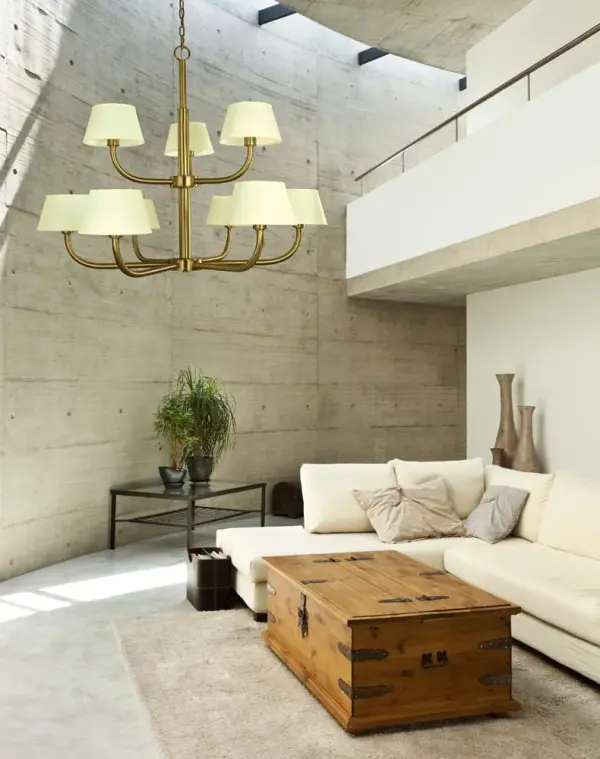 The Emma 9-Light Foyer Chandelier commands attention with its impressive 49-inch width and dramatic 41-inch height. Featuring nine lights with elegant off-white linen shades and a warm brushed brass finish, this fixture transforms grand entryways into welcoming spaces. - alternate view