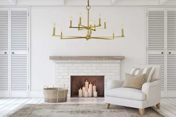 The Evelyn 12-light chandelier commands attention with its impressive 48-inch width and 27-inch height. The brushed brass finish adds warmth and sophistication, while the 12 candle-style lights provide ample illumination for grand spaces. - alternate view