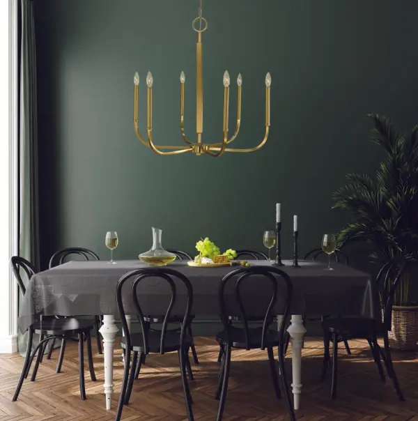 The Manhattan chandelier brings contemporary elegance to dining spaces with its geometric design and warm brushed brass finish. Six candle-style lights provide ample illumination while the 28-inch width suits medium to large tables perfectly. - alternate view