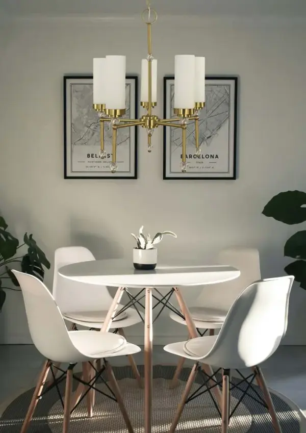 The Emily chandelier combines classic proportions with contemporary brushed brass finish, making it a versatile choice for dining rooms and kitchen islands. Its 24-inch width and 5-light configuration provide ample illumination while maintaining an elegant profile. - alternate view