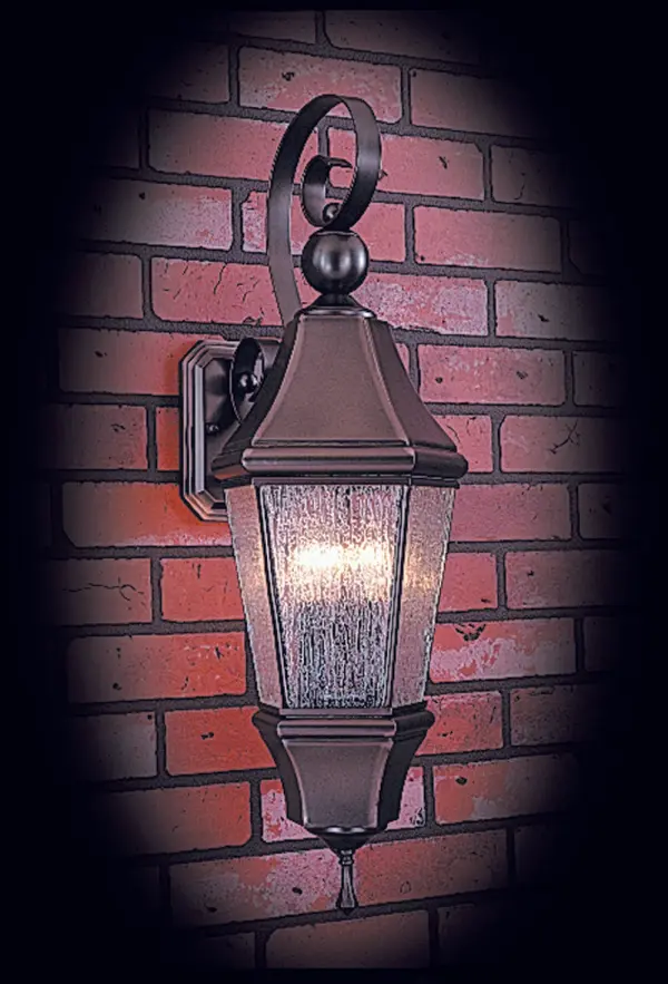 The Normandy 3-light wall mount brings European elegance to outdoor spaces with its substantial 28.5-inch height and Siena Bronze finish. Rain glass panels create ambient lighting while the traditional design complements classic architecture.