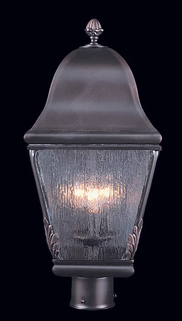 This handcrafted post mount lantern combines solid brass construction with distressed glass for authentic Old World charm. The textured glass beautifully refracts light while the iron finish adds rustic character to any outdoor space.