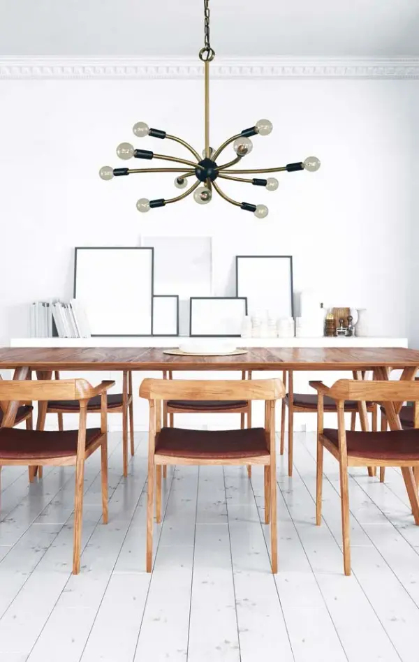 The Comet chandelier makes a bold statement with 12 exposed bulbs and a sophisticated antique brass and matte black finish. Its generous 27-inch width and dramatic design create stunning visual impact over dining tables. - alternate view
