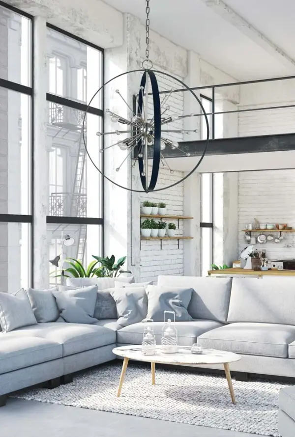 The Nucleus chandelier makes a bold architectural statement with its 10-light configuration and contemporary two-tone finish. At 34 inches wide and extending over 9 feet, this substantial fixture is designed for high-ceiling foyers and grand entryways. - alternate view
