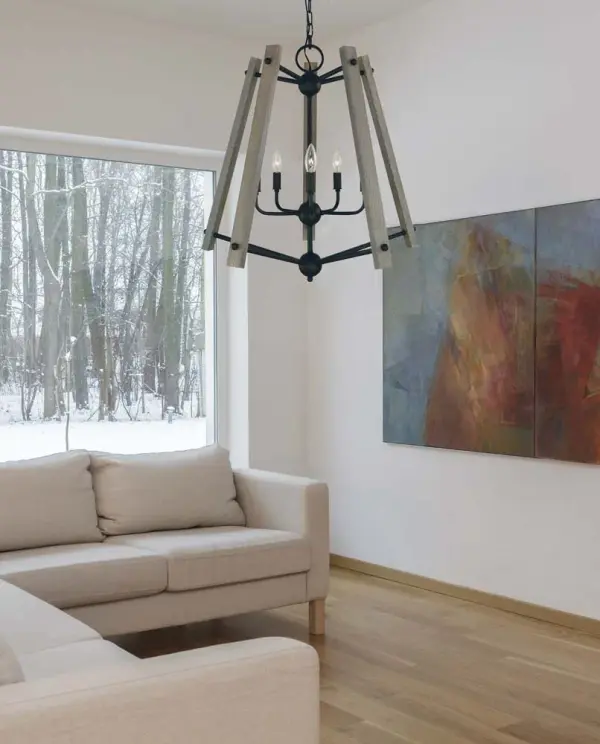 The Meredith chandelier combines transitional elegance with contemporary styling in a sophisticated matte black finish. Its 24-inch width makes it perfectly sized for medium dining spaces, while the candle-style design adds timeless appeal. - alternate view