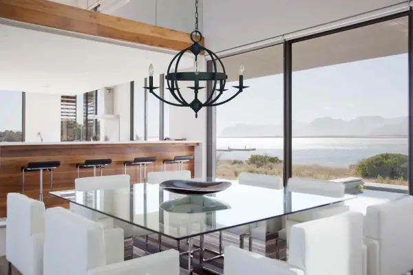 The Aurora chandelier brings contemporary elegance to dining spaces with its clean-lined 5-light design and sophisticated matte black finish. At 26 inches wide, it's perfectly sized for medium dining rooms and kitchen islands. - alternate view