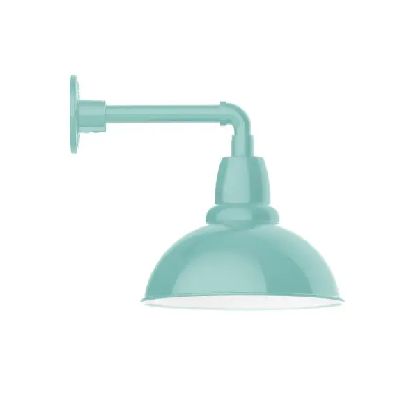 Our outdoor wall lights, inspired by 1920's industrial lighting, in straight arm styles are great for use as sign or awning lights, garage or barn lights. This vintage look works well indoors also, our smallest sizes will illuminate a restaurant menu board, bookcase, or shelving unit. Our Cafe shades will help transform your outdoor living area into a warm and intimate gathering space. Collection: Cafe Finish: Sea Green Glass: 12 inch Cafe Notes: Option (1) A19 LED and 3-Integrated 8W, 10W, 15W Width: 12.00" Height: 13.38" Length: 16.00" Weight: 8.00 lb Extension from Wall: 16.00" Canopy: 4.625" diameter Number of Bulbs: 1 Maximum Wattage: 100.00 W Bulb Type: A19 Bulb Base: E26 Medium Light Source: Incandescent or LED equivalent Dimmable Voltage: 120.00 V Country of Origin: US Safety Listing: UL/cUL Safety Rating: Wet Dark Sky LED Manufacturer Warranty: 1-year limited warranty on the fixture.