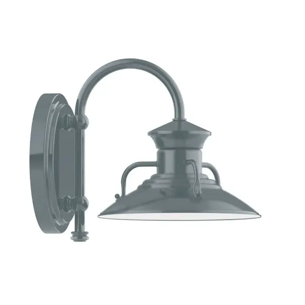 Our wall sconces are our smallest outdoor fixtures, but they add just the right amount of light to your entryway. Hang alone or in pairs on either side of a front door or garage, even inside next to a bed. Available in multiple shade styles to suit your décor, be it modern farmhouse, coastal cottage, or industrial loft. Collection: Homestead Finish: Slate Gray Glass: 8 inch Homestead Width: 8.00" Height: 9.00" Length: 10.75" Weight: 7.00 lb Extension from Wall: 10.75" Canopy: 6.875" diameter Number of Bulbs: 1 Maximum Wattage: 8.00 W Bulb Type: LED Light Source: LED Light Output: 800.00 lm Color Temperature: 3000 K CRI: 90 Dimmable Rated Average Life: 50,000 Voltage: 120.00 V Country of Origin: US Safety Listing: UL/cUL Safety Rating: Wet Dark Sky LED Manufacturer Warranty: 1-year limited warranty on the fixture.