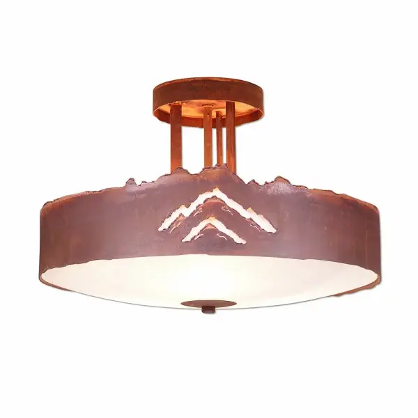 Farmhouse style Semi-Flush Ceiling Lights handmade in USA by Avalanche Ranch Lighting. This light features our exclusive metal wildlife art of a Mountain. This Semi-Flush Light is ideal for anyone looking to add rustic character or unique log home lighting to their home. Dimensions (inches): 10h x 15w and Takes 3 - Type A19 bulbs - 60W max. each (mica) or 100W max. each (glass) Collection: Crestline-Mountain Cutout Finish: Rust Patina Glass: Frost White Glass Width: 15.00" Height: 10.00" Number of Bulbs: 3 Maximum Wattage: 100.00 W Bulb Type: A19 Bulb Base: Medium