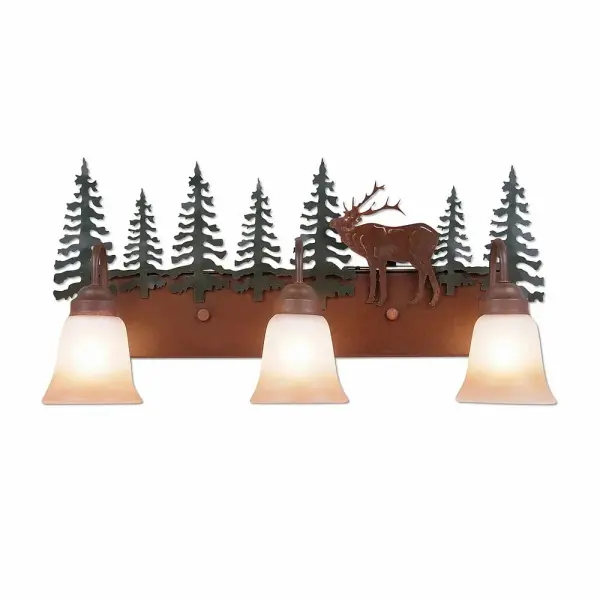 Mountain Cabin style Bath Vanity Lights handmade in USA by Avalanche Ranch Lighting. This light features our exclusive metal wildlife art of a Elk. This Bath 3 Light is ideal for anyone looking to add rustic character or unique log home lighting to their home. Dimensions (inches): 13h x 26w and Takes 3 - Type A19 bulbs - 100W max. each Collection: Denali-Mountain Elk Finish: Cedar Green/Rust Patina Glass: Two-Toned Amber Cream Glass Width: 25.00" Height: 13.00" Extension from Wall: 8.00" Number of Bulbs: 3 Maximum Wattage: 100.00 W Bulb Type: A19 Bulb Base: Medium