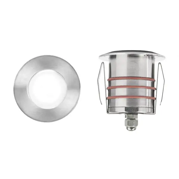 LED Landscape recessed inground indicator luminaire for both soft and hard ground applications available in 1" or 2" sizes with round, slim, and square face plate options. The indicator light is perfect for outdoor applications, including wells and ponds, decks and patios, inground, as well as ceiling and wall applications. Factory sealed and IP68 Rated for Wet Locations or continuous immersion up to 5 meters underwater. Each indicator light includes 6' of low voltage burial cable, direct burial gel-filled wire nuts, and an optional spring retention clip. Magnetic Power supply is required. Concrete Pour Kits are available for additional installation options. Collection: 2021 Sub-Brand: Landscape Finish: Stainless Steel Notes: 2In Inground LED 12V Round Indicator Light In Stainless Steel Width: 2.75" Height: 3.13" Length: 2.75" Weight: 1.10 lb Extension from Wall: 2.75" Wire: 6` Bulbs Included Number of Bulbs: 1 Maximum Wattage: 4.00 W Bulb Type: Module Bulb Base: LED Module Light Source: LED Light Output: 170.00 lm Delivered Lumens: 245.00 lm Color Temperature: 3000 K CRI: 85 Dimmable Beam Spread: 25.00° Rated Average Life: 70000 Voltage: 9.00 V Material: Solid stainless steel construction Country of Origin: China Safety Listing: UL, cUL Safety Rating: UL, cUL LED Manufacturer Warranty: 10 year, Lifetime Finish Instructions Parts Diagram