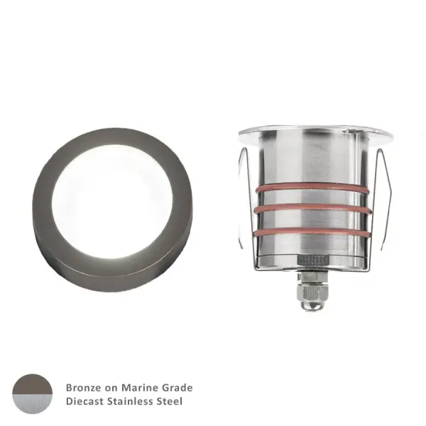 LED Landscape recessed inground indicator luminaire for both soft and hard ground applications available in 1" or 2" sizes with round, slim, and square face plate options. The indicator light is perfect for outdoor applications, including wells and ponds, decks and patios, inground, as well as ceiling and wall applications. Factory sealed and IP68 Rated for Wet Locations or continuous immersion up to 5 meters underwater. Each indicator light includes 6' of low voltage burial cable, direct burial gel-filled wire nuts, and an optional spring retention clip. Magnetic Power supply is required. Concrete Pour Kits are available for additional installation options. Collection: 2011 Sub-Brand: Landscape Finish: Bronze Stainless Steel Notes: 2In Inground LED 12V Slim Round Indicator Light In Bronzed Stainless Steel Width: 2.06" Height: 3.13" Length: 2.06" Weight: 1.10 lb Extension from Wall: 2.06" Wire: 6` Bulbs Included Number of Bulbs: 1 Maximum Wattage: 4.00 W Bulb Type: Module Bulb Base: LED Module Light Source: LED Light Output: 170.00 lm Delivered Lumens: 245.00 lm Color Temperature: 3000 K CRI: 85 Dimmable Beam Spread: 25.00° Rated Average Life: 70000 Voltage: 9.00 V Material: Solid stainless steel construction Country of Origin: Thailand Safety Listing: UL, cUL Safety Rating: UL, cUL LED Manufacturer Warranty: 10 Year Instructions Parts Diagram