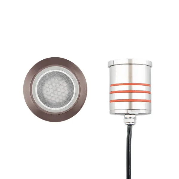 LED Landscape recessed inground indicator luminaire for both soft and hard ground applications available in 1" or 2" sizes with round, slim, and square face plate options. The indicator light is perfect for outdoor applications, including wells and ponds, decks and patios, inground, as well as ceiling and wall applications. Factory sealed and IP68 Rated for Wet Locations or continuous immersion up to 5 meters underwater. Each indicator light includes 6' of low voltage burial cable, direct burial gel-filled wire nuts, and an optional spring retention clip. Magnetic Power supply is required. Concrete Pour Kits are available for additional installation options. Collection: 2022 Sub-Brand: Landscape Finish: Bronze Stainless Steel Notes: 2In Inground LED 12V Round Indicator Light With Honeycomb Louver In Bronzed Stainless Steel Width: 2.75" Height: 3.13" Length: 2.75" Weight: 1.19 lb Extension from Wall: 2.75" Bulbs Included Number of Bulbs: 1 Maximum Wattage: 4.00 W Bulb Type: Module Bulb Base: LED Module Light Source: LED Light Output: 170.00 lm Delivered Lumens: 165.00 lm Color Temperature: 3000 K CRI: 85 Dimmable Beam Spread: 25.00° Rated Average Life: 70000 Voltage: 9.00 V Material: Solid stainless steel construction Country of Origin: Thailand Safety Listing: UL, cUL Safety Rating: UL, cUL LED Manufacturer Warranty: 10 Year Parts Diagram