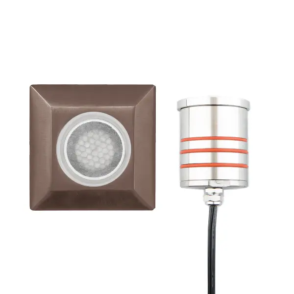 LED Landscape recessed inground indicator luminaire for both soft and hard ground applications available in 1" or 2" sizes with round, slim, and square face plate options. The indicator light is perfect for outdoor applications, including wells and ponds, decks and patios, inground, as well as ceiling and wall applications. Factory sealed and IP68 Rated for Wet Locations or continuous immersion up to 5 meters underwater. Each indicator light includes 6' of low voltage burial cable, direct burial gel-filled wire nuts, and an optional spring retention clip. Magnetic Power supply is required. Concrete Pour Kits are available for additional installation options. Collection: 2052 Sub-Brand: Landscape Finish: Bronze Stainless Steel Notes: 2In Inground LED 12V Square Indicator Light With Honeycomb Louver In Bronzed Stainless Steel Width: 2.75" Height: 3.13" Length: 2.75" Weight: 1.32 lb Extension from Wall: 2.75" Bulbs Included Number of Bulbs: 1 Maximum Wattage: 4.00 W Bulb Type: Module Bulb Base: LED Module Light Source: LED Light Output: 170.00 lm Delivered Lumens: 165.00 lm Color Temperature: 3000 K CRI: 85 Dimmable Beam Spread: 25.00° Rated Average Life: 70000 Voltage: 9.00 V Material: Solid stainless steel construction Country of Origin: Thailand Safety Listing: UL, cUL Safety Rating: UL, cUL LED Manufacturer Warranty: 10 Year Parts Diagram