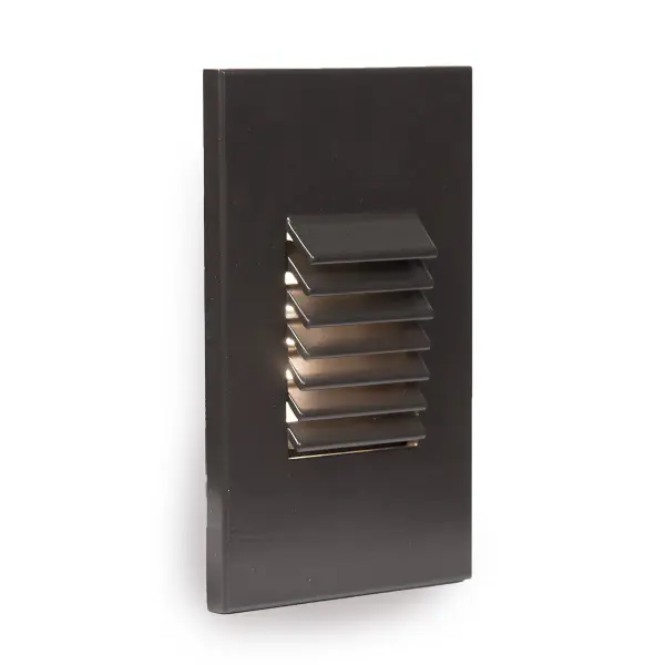 WAC Lighting Step and Wall Lights are designed to seamlessly blend into any architecture featuring a sleek interchangeable magnetic faceplate with no visible hardware. These luminaires offer enhanced energy-efficient functionality and optimized light output to adequately illuminate stairs, walls and walkways with little or no glare. Light engine is IP66 Rated for both indoor and outdoor applications. Collection: 4061 Sub-Brand: Landscape Finish: Bronze on Aluminum Notes: LED Low Voltage Vertical Louvered Step And Wall Light Amber In Bronze Width: 5.00" Height: 1.75" Length: 3.13" Weight: 0.40 lb Extension from Wall: 3.13" Bulbs Included Number of Bulbs: 1 Maximum Wattage: 2.00 W Bulb Type: Module Bulb Base: LED Module Light Source: LED Light Output: 38.00 lm Delivered Lumens: 38.00 lm CRI: 90 Dimmable Rated Average Life: 60000 Voltage: 9.00 V Material: Corrosion resistant aluminum alloy Country of Origin: China Safety Listing: UL, cUL Safety Rating: UL, cUL ADA LED Manufacturer Warranty: 10 Year Parts Diagram