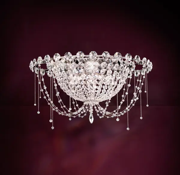 Morning dew sparkling on fine threads of silk in the early light of day.  Chrysalita features a glowing empire chandelier cocooned within another.  Glittering Radiance® Crystal jewels delight in a jovial symphony of light.