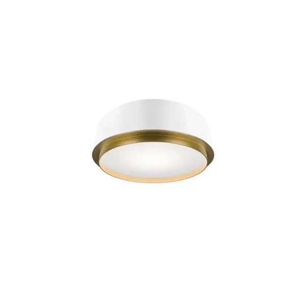 An aged brass circlet within a black frame holds a creamy diffuser, offering soft ambient light to surfaces below.