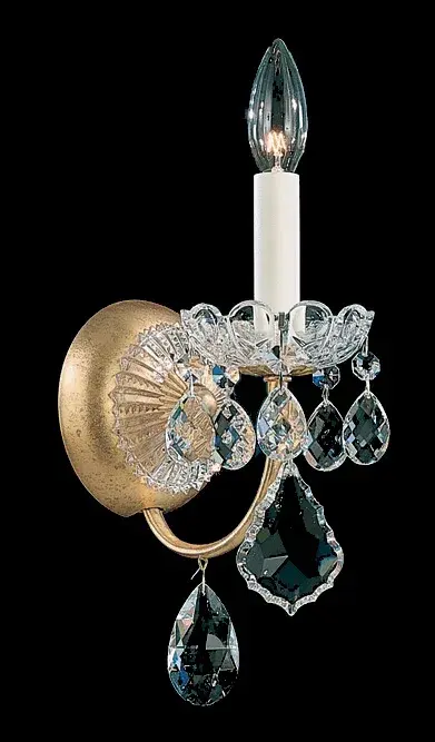 Designed with an unapologetically opulent display of shimmering crystal in the French Baroque style of the late 17th century, New Orleans is a festive dance of twirling branches around a sculptural crystal column. Sumptuously decorated with a flight of garlands, cups and jewels, this Schonbek introduces an undeniable sense of grandeur.
