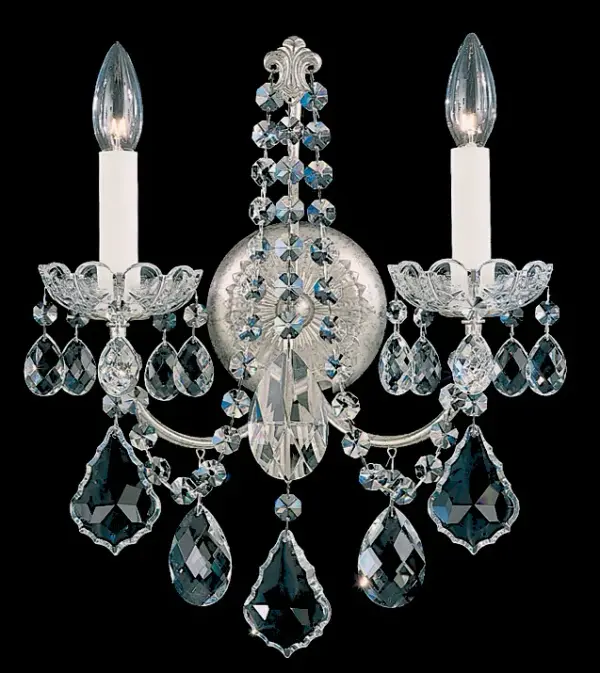 Designed with an unapologetically opulent display of shimmering crystal in the French Baroque style of the late 17th century, New Orleans is a festive dance of twirling branches around a sculptural crystal column. Sumptuously decorated with a flight of garlands, cups and jewels, this Schonbek introduces an undeniable sense of grandeur.